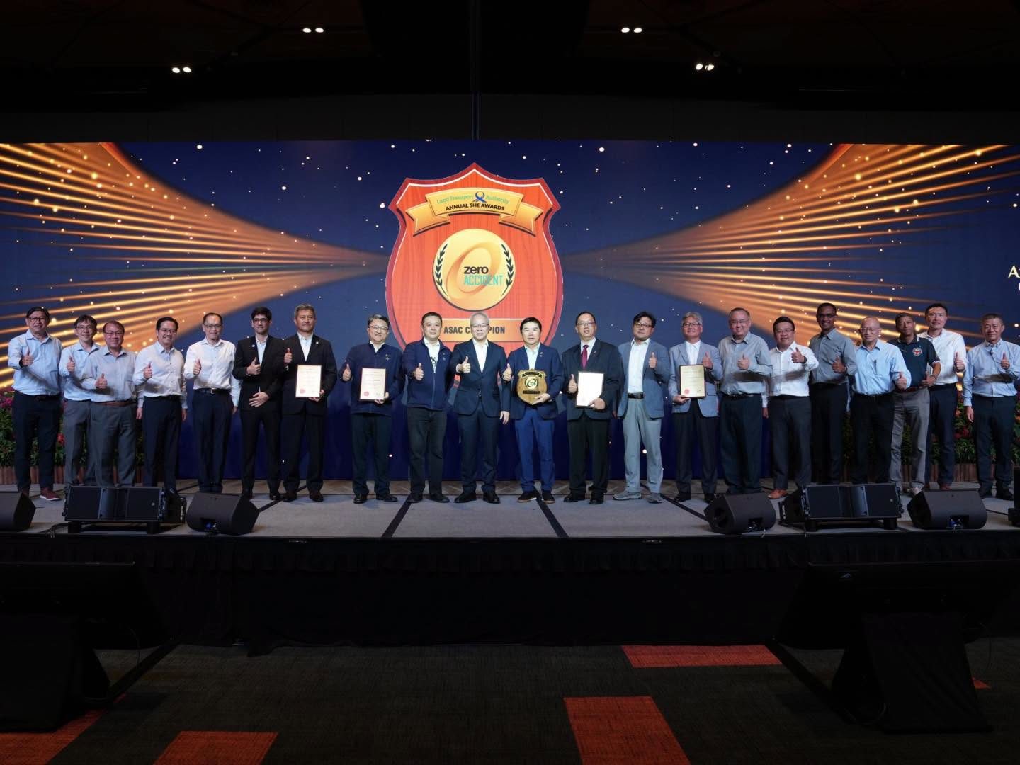 Award recipients and guests on stage in front of the ASAC Champion shield, LTA Annual SHE Awards 2026